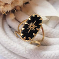 Bague en acier inoxydable doré avec pierre noire ovale et motif étoile