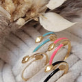 Bague serpent dorée ajustable en acier inoxydable, versions colorées présentées ensemble