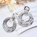 Boucles d’oreilles mode argentées pour femme – design rond élégant en acier inoxydable