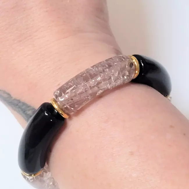 Bracelet élastique femme perles noires et cylindre transparent