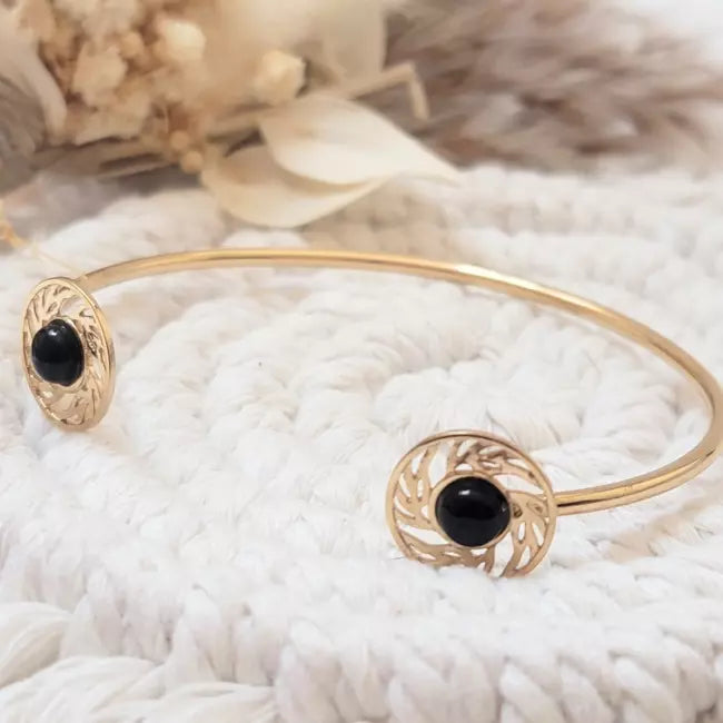 Bracelet jonc doré femme avec deux cabochons noirs et motifs ajourés