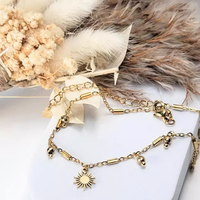 Chaîne de cheville femme en acier inoxydable doré avec pendentif soleil et petites perles