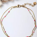 Chaîne de cheville dorée avec perles roses et blanches, bijou tendance pour femme