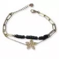 Bracelet femme double chaîne dorée en acier inoxydable, perles noires et pendentif fleur stylisée – bijou élégant et moderne