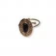 Bague dorée ajustable avec cabochon noir ovale et finition martelée – style vintage élégant